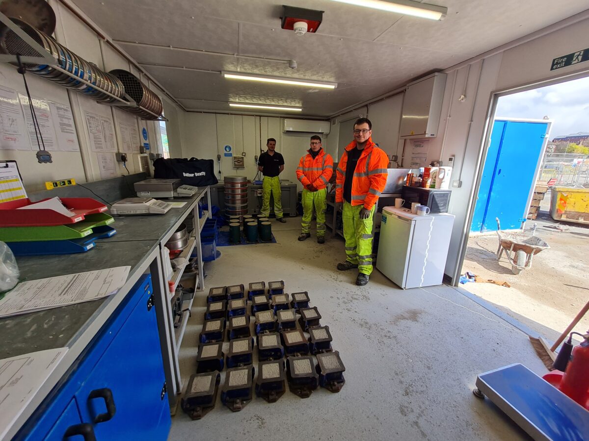 Group of people in hi-viz coats in a room