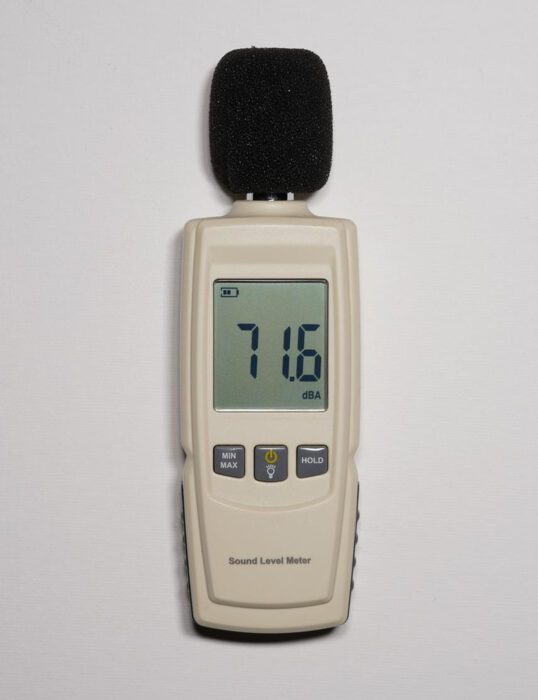 Device stuck to wall measuring sound