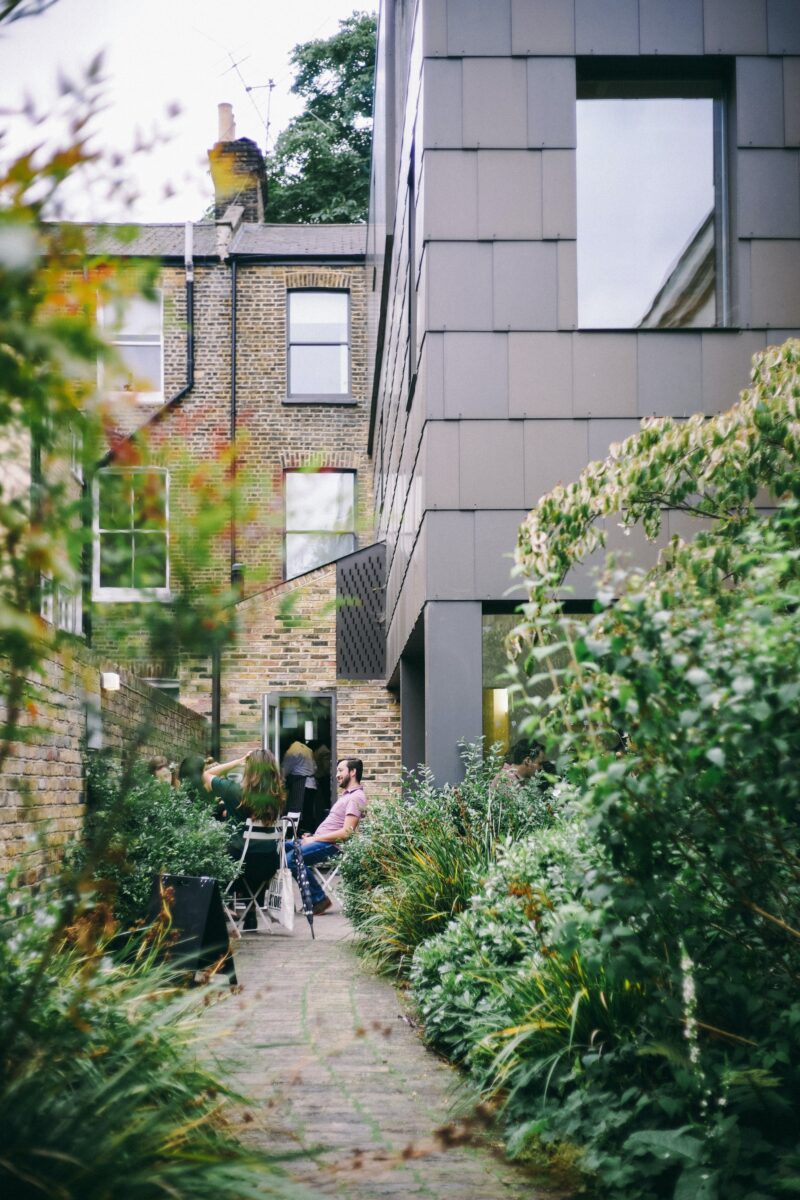 Garden with a terraced house and extension in the background