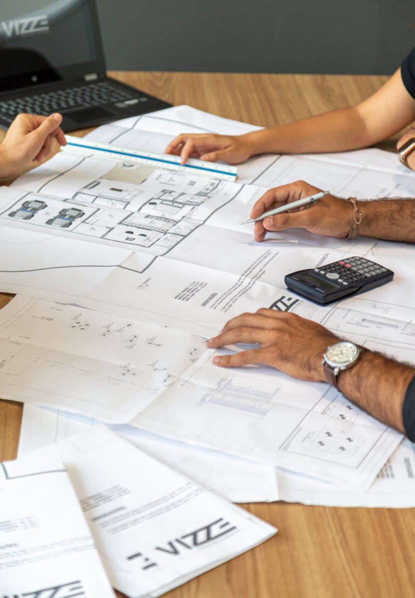 Technicians working on architectural plans