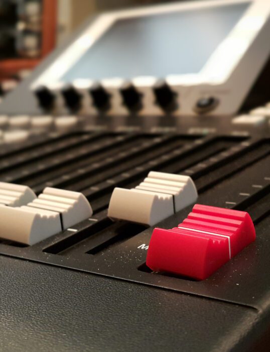 Faders on a soundboard