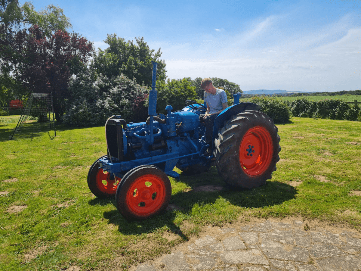 Thomas on a tractor